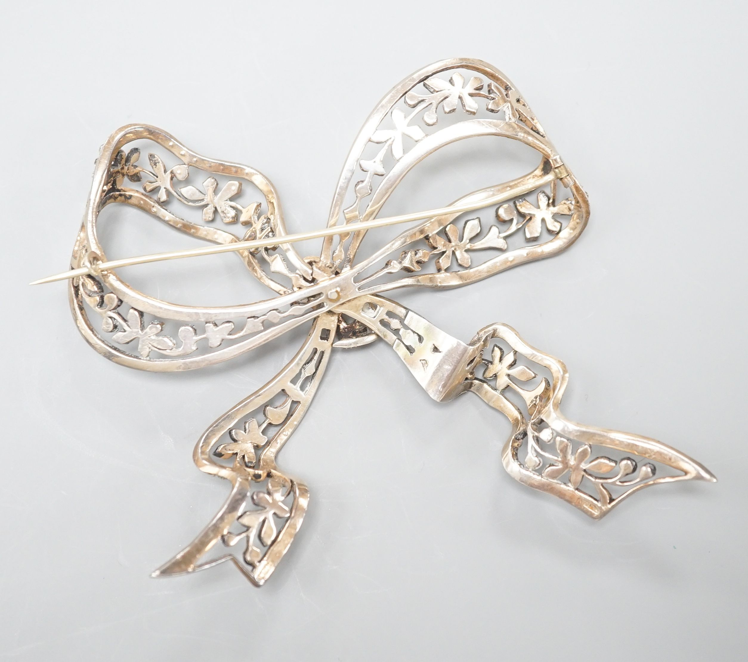 A sterling and paste set large ribbon bow brooch, width 95mm.